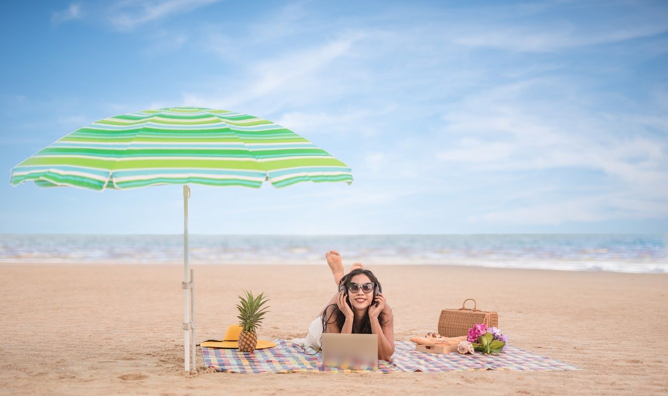 asian-woman-relaxing-lying-on-beach-mat-in-the-bea-2022-06-15-23-53-56-utc.jpg