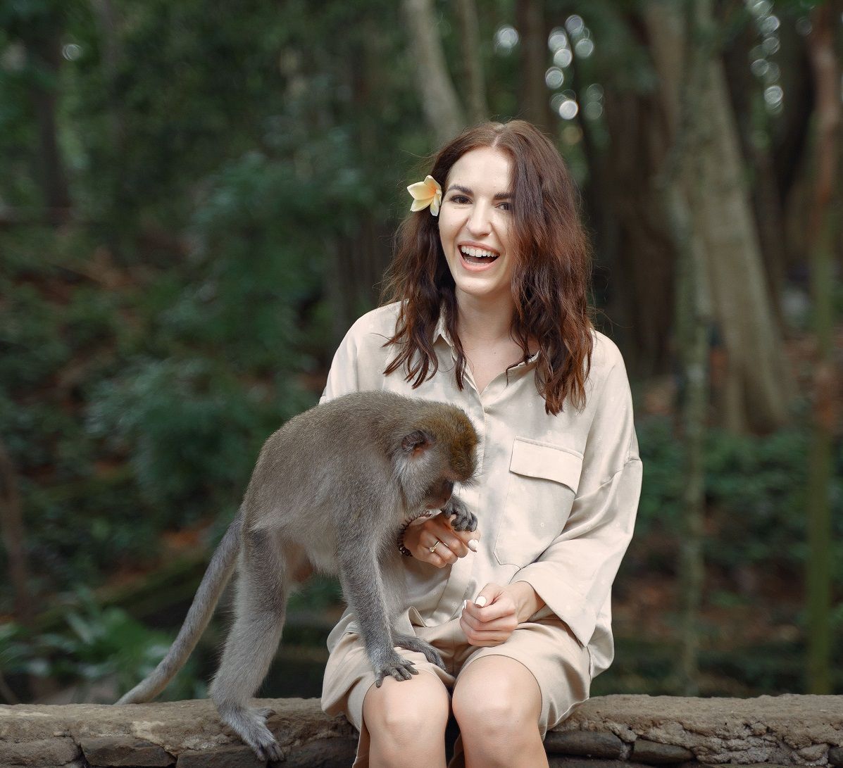 woman-on-vacation-playing-with-a-monkey-at-monkey-forest-ubud-20212-08-29-09-40-31-utc.jpg