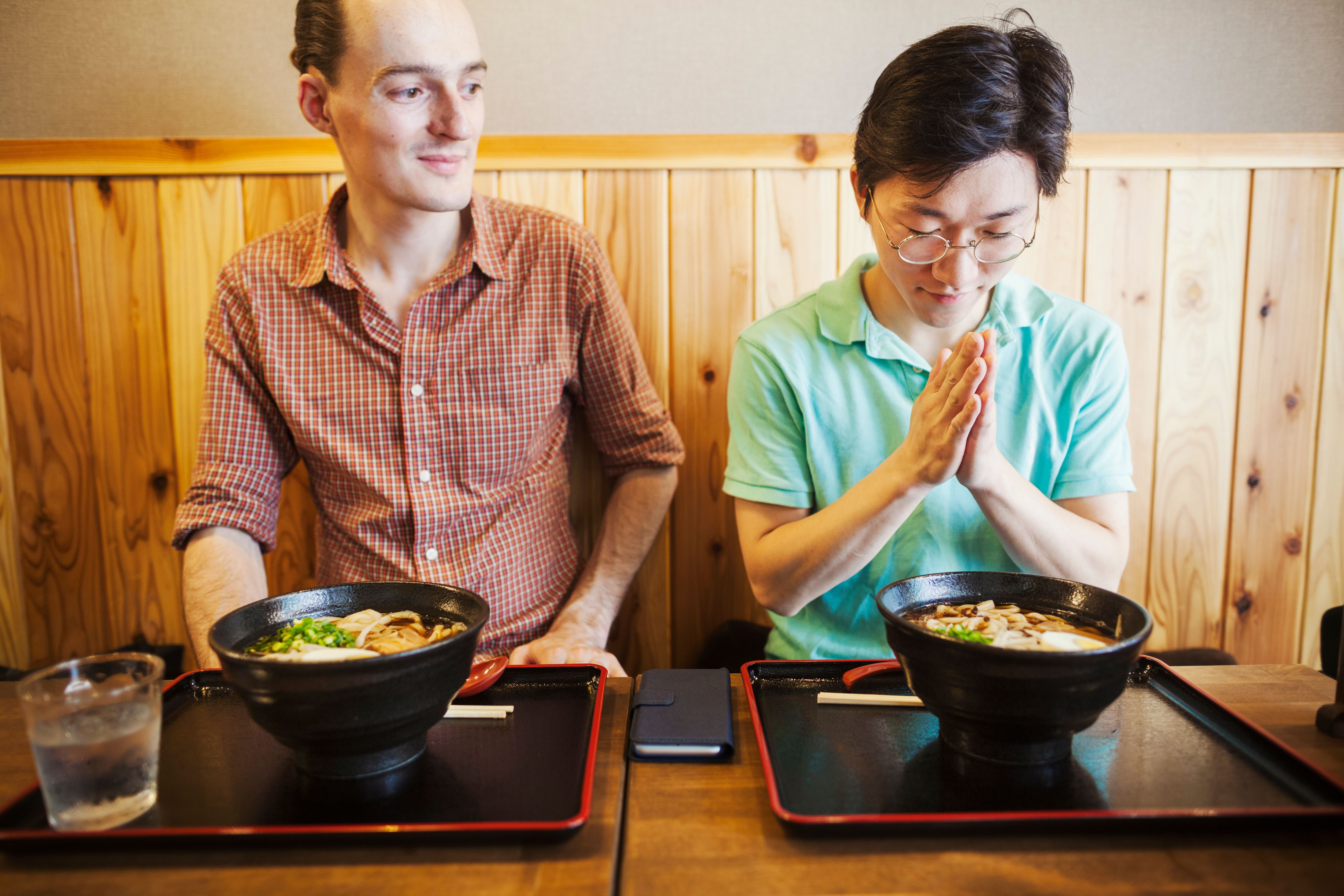 two-people-in-a-tokyo-restaurant-one-making-a-itadakimasu.jpg